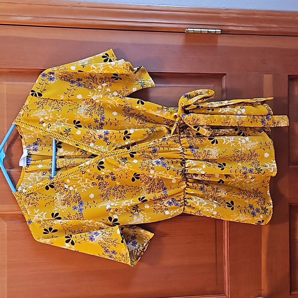 Sienna Sky kimono style wrap blouse. Mid sleeve gold with spring floral design